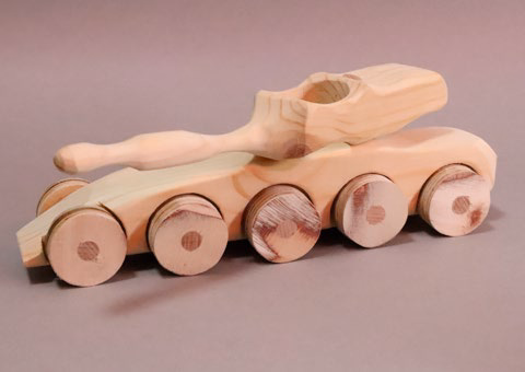 A wooden model from his works — the palette's warm tone sits here